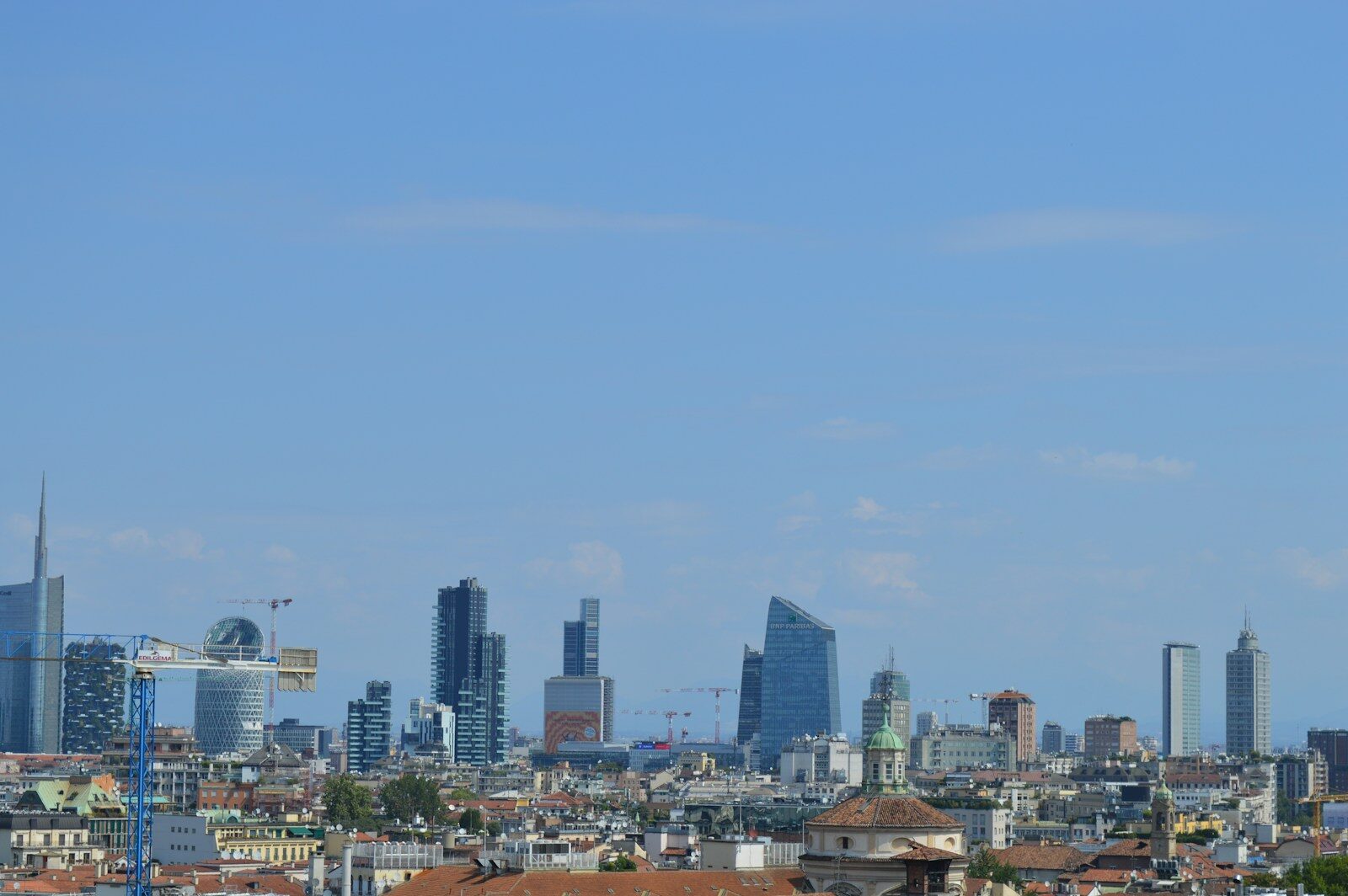 Milan's skyline on a bright, sunny day.